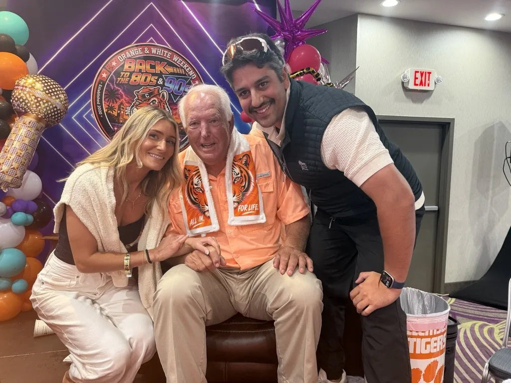 Three guests at the evening party, one wearing a Tiger towel