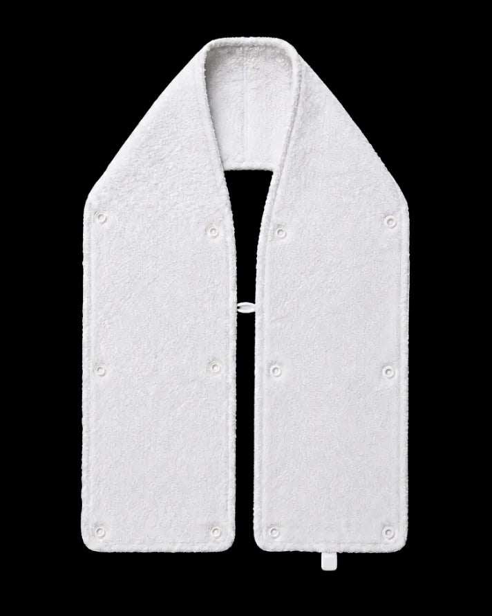 The towel laid in a V with snaps around the edge of both ends