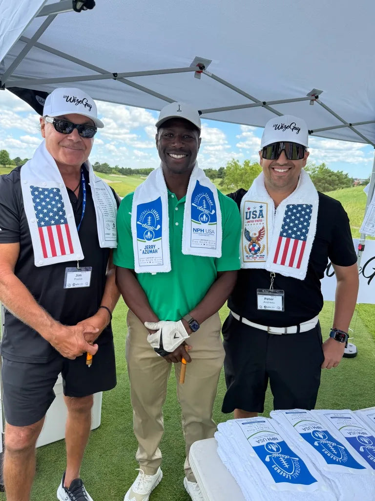 Three guests at the LivWizeGuy tent wearing Skin towels, one with a Football Legends Classic Skin