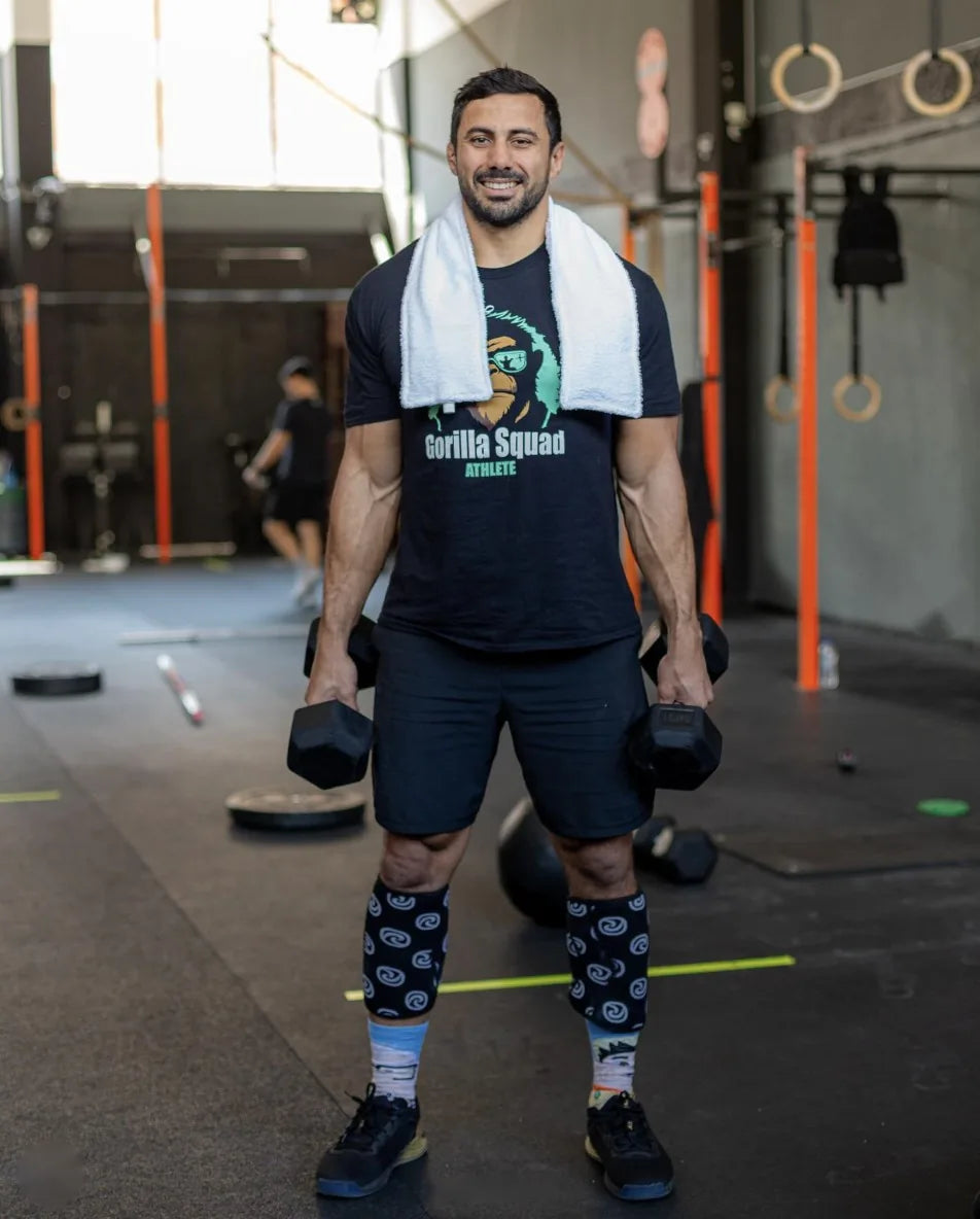 Athlete in the gym with a LivWizeGuy towel around his neck